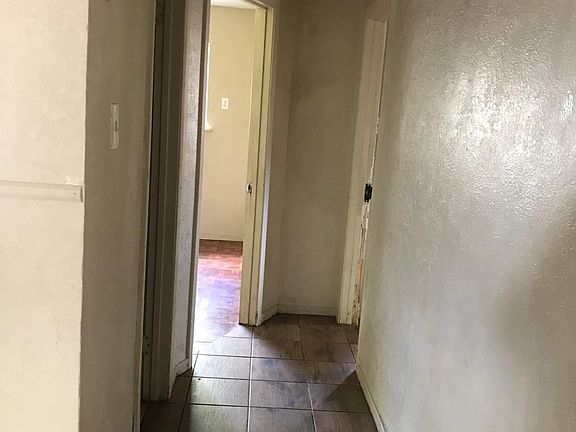 Hallway leading to two right side of house