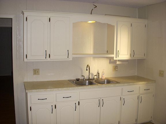 the shelf over the sink is a great place for a microwave.