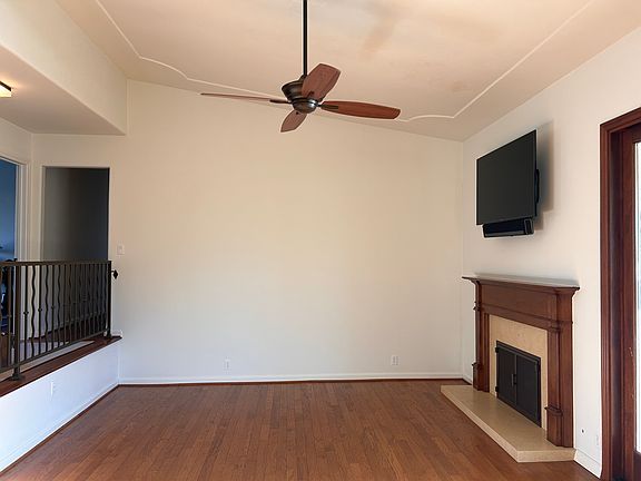 Large living room with fireplace and large screen tv