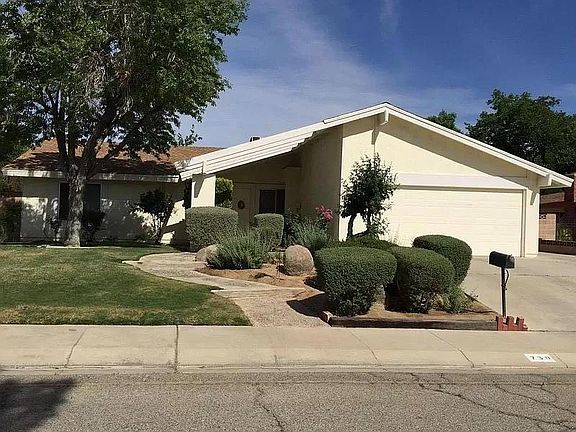 Beautifully landscaped front yard w/ side gate and 2 car garage. The Master bedroom faces the front yard on the north side of the house.