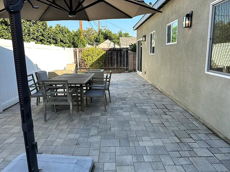BBQ and entertainment space.

Amenities included: Outdoor shade umbrella and family table.