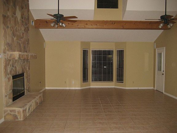 22x18 living room in main house, cathedral ceilings, rock f/p, beautiful tile