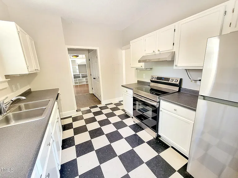 Kitchen all stainless appliances including a dishwasher