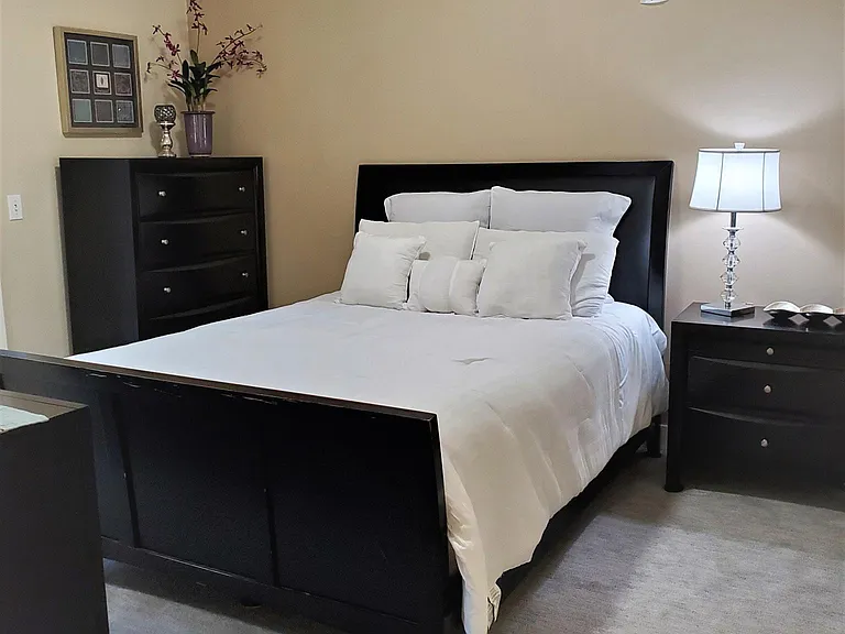 Master bedroom with attached master bathroom with linen closet