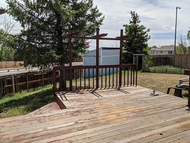 Large rear deck and yard. Owners reserve the use of the shed. Deck is to be stained soon.