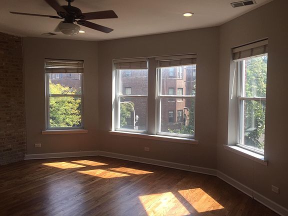 Living Room pictured unfurnished. Beautiful south facing light streams in bay windows.