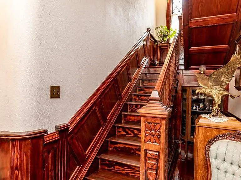 Historic Natural Wood throughout the Mansion along with carved wood Staircase.