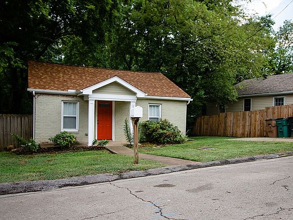 Front of house w/parking pad