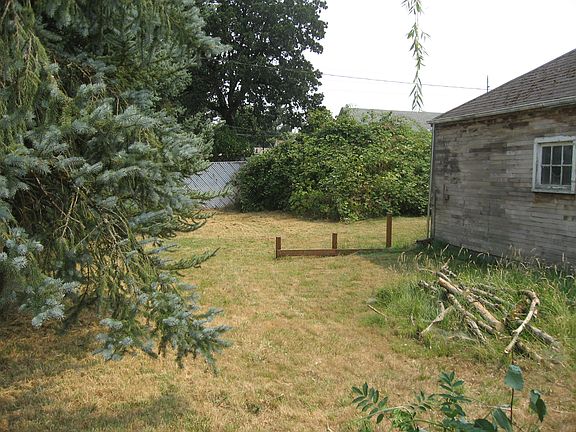 between garage & alley