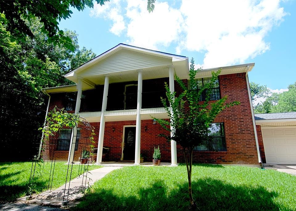 Welcome to your stately new home, nestled in the trees and situated on a total of almost 5 acres.