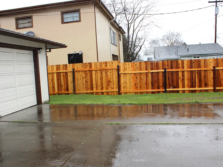 Large driveway for multiple cars or trailer/boat.
