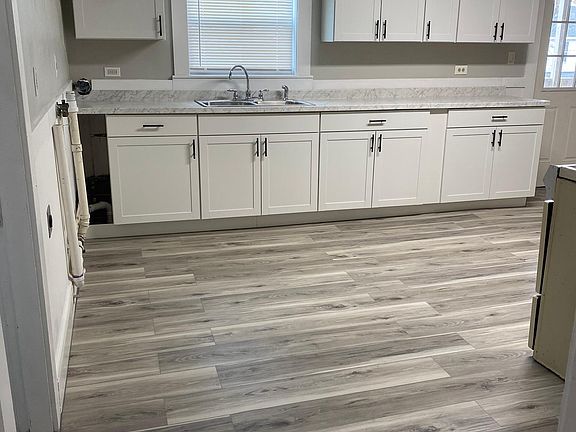 Kitchen: New floors, new kitchen cabinets, new doors, new lighting, new windows to reduce energy costs, new stainless steel fridge, new walls/ceiling and wainscotting painted, washer/dryer hookups, new stainless steel sink, new countertopsBedroom 1: refin