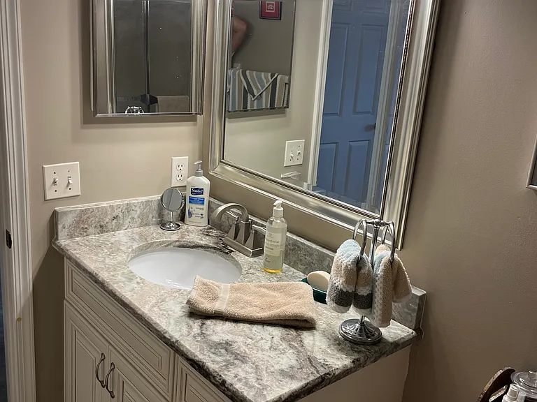 Updated guest bathroom with tub.