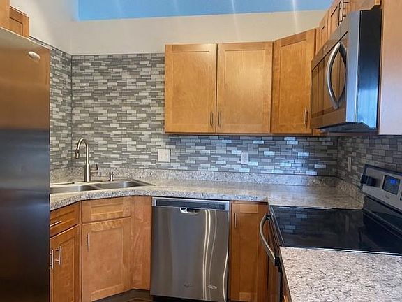 Remodeled kitchen with SS appliances.