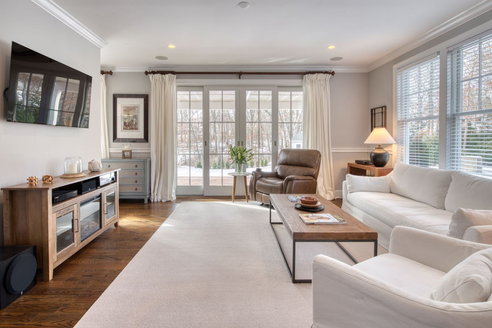  second living room with glass sliding doors and windows to backyard