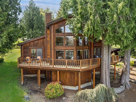 The home sits up on a knoll and features an impervious deck, giving you dry storage underneath and creating a great outdoor space to walk barefoot and enjoy the view.