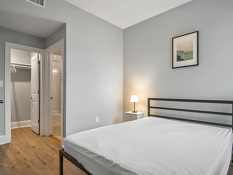Furnished room includes walk-in closet and en-suite bathroom