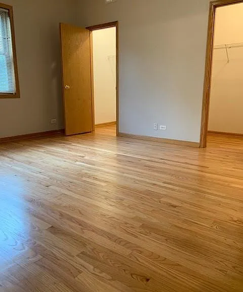 bedroom 1 with 2 walk in closets and linen closet