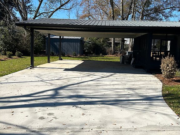 Large carport and screen deck off of the maser bedroom
