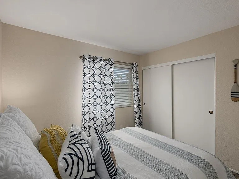 Second bedroom, with bathroom located in the hallway.