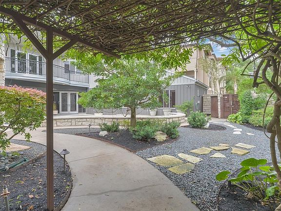 This unique home is centered around a stunning front courtyard equipped with a pool and spa.  Ultimate privacy is provided with an ornate steal and limestone fence with mature trees and landscaping.