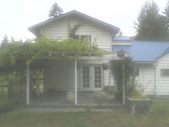 Back of home and grape vine