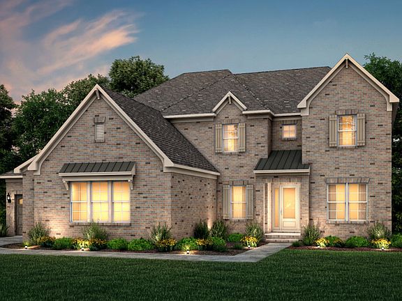 Hampton Exterior 16 features brick, covered front door and 3 car sideload garage