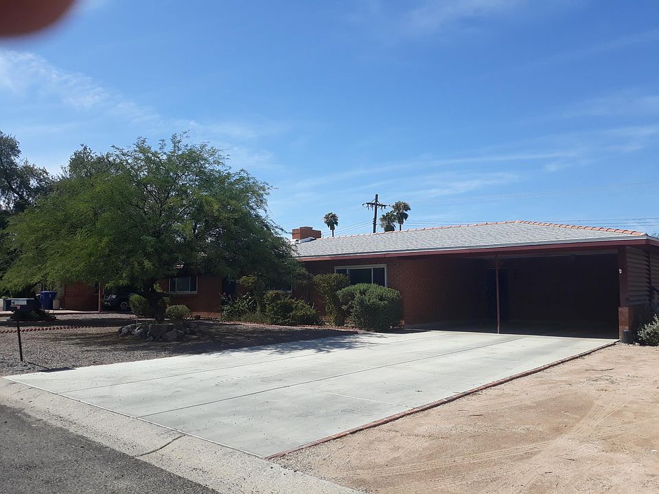 the front view of the house with two car port places