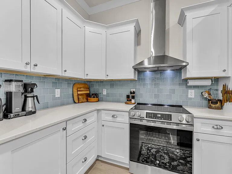 Electric stove/oven with vented hood, soft close doors + drawers, and dual garbage bin drawer