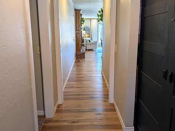 Front entry. Hallway to bedrooms to left, flex room 1 to the right.