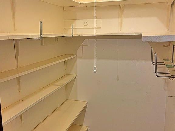 Large walk-in storage closet located in front hall