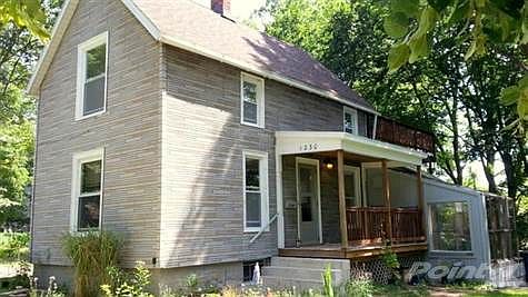 The farmstead in the middle of Ann Arbor.  Built in 1893 - as the assessors office suggests.  Surrounded on all sides by spaciousness, with an acre wooded lot across the street.  A real sense of the country, but just 6 blocks from Zingermans and the UM Hospitals.