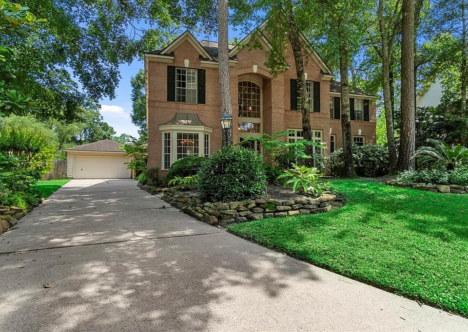 Majestic home in highly sought after Teal Point with long driveway with OVERSIZED detached garage.