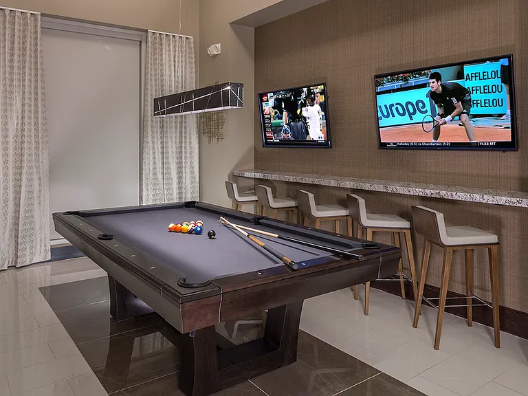 Sleek and inviting billiards space.