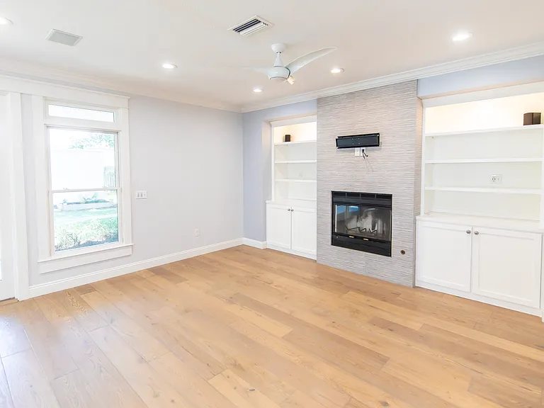 Living room is wired for surround sound with built in speakers for the TV.