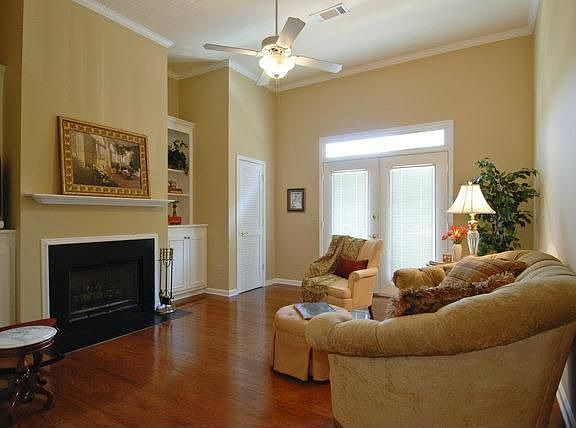 Gleaming hardwoods in Living area with a Juliet balcony. 