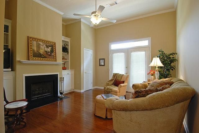 Gleaming hardwoods in Living area with a Juliet balcony. 