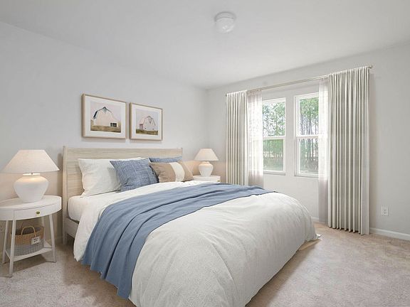 Unwind in the Owner s Suite with plush carpet and plenty of space to relax. - Model Representation