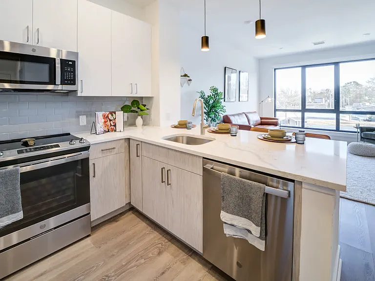 Kitchen with Stainless Steel Appliances and White Granite Countertops