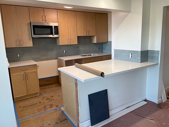 Totally new kitchen, all stainless steel with GE 30" gas stove no preheat Air Fry (being installed tomorrow) LG dishwasher (being installed tomorrow) Haier Refrigerator (being installed tomorrow), garbage disposal and GE Microwave with built in fan-.