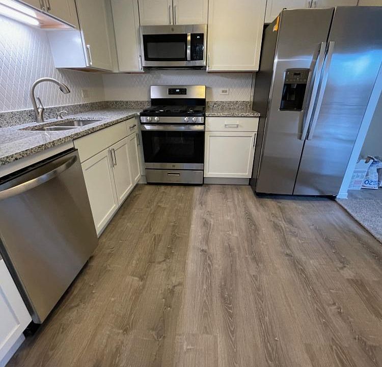 Beautiful new Kitchen with granite countertops and all new appliances including dishwasher, microwave, oven, and refrigerator with ice maker.