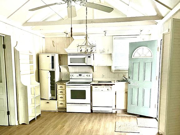 Kitchen area with a door to the back porch and carport.