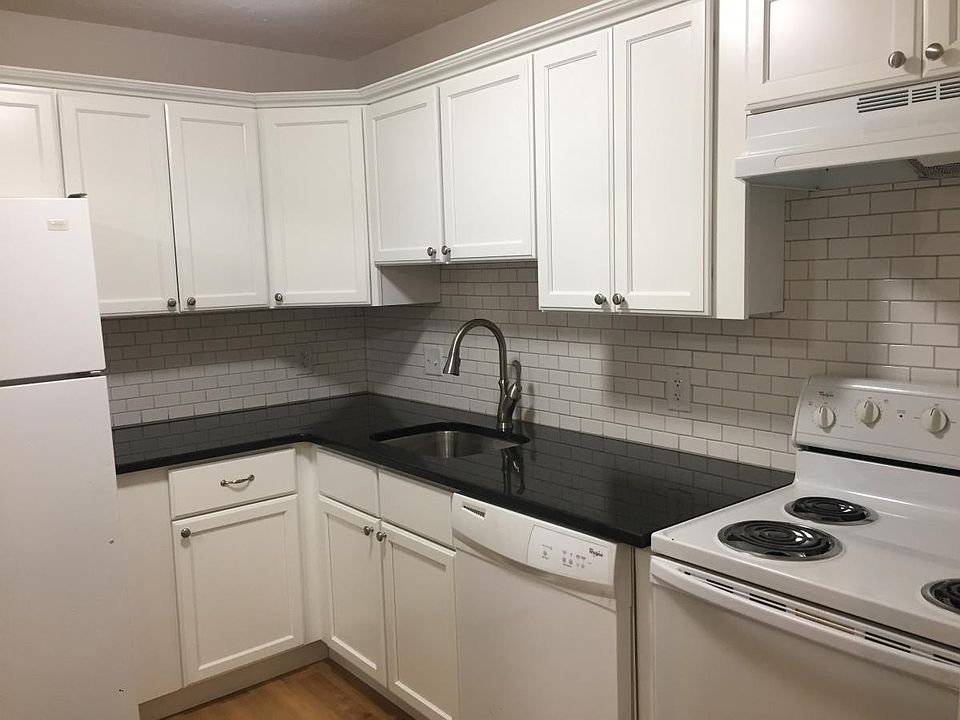 Updated kitchen with granite countertop.