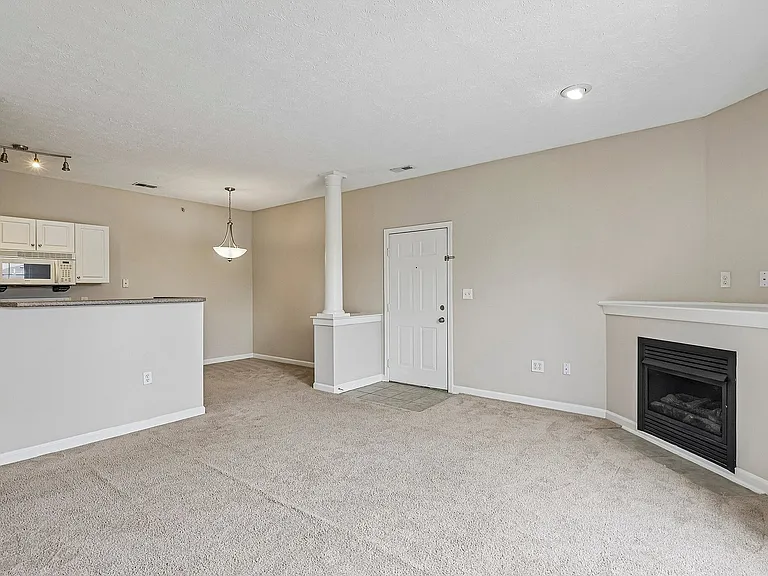 Inviting living space with plush carpeting