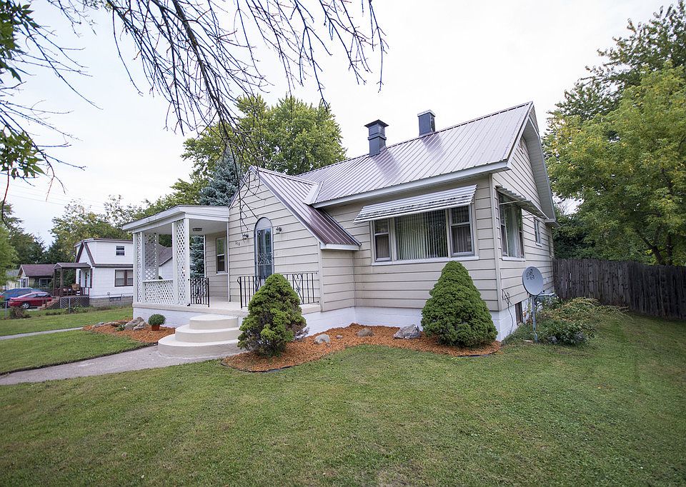 ONE OF A KIND ON OXFORD... this charming three bedroom cape cod style Aladdin home has so much character! Original round solid wood entrance door, beautiful full wall stone fireplace, large living room with open floor plan, hardwood floors throughout, updated kitchen. Home also has a 2.5 car garage, new metal roof and a full basement with b-dry system, back up sump pump and additional possible bedroom downstairs. Above ground pool included with deck and private fully fenced in yard, makes a great place to entertain. All this on a large double lot. Call today for your personal showing (989)415-8254!
