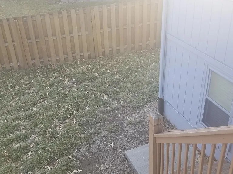 Backyard stairs leading to the lawn.