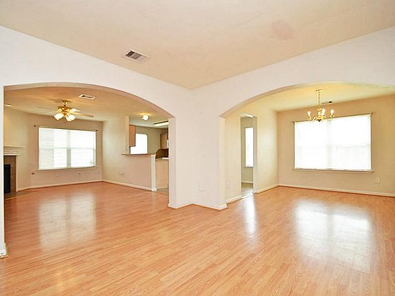 view from the foyer of the dinning room and living room as you enter