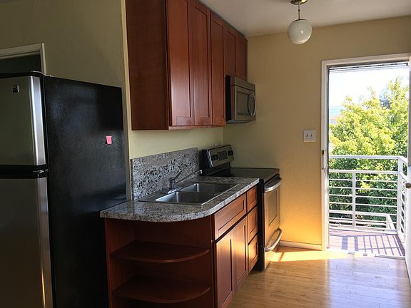 balcony entrance from private backyard into kitchen area