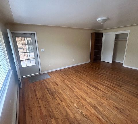 Large main room with tons of natural light and new blinds.