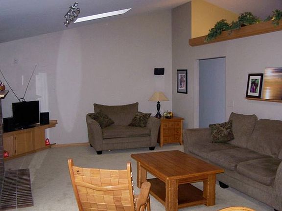 Great room with sky lights and cathedral ceiling.